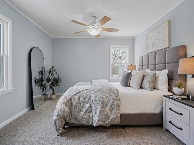 bedroom featuring ornamental molding, carpet, baseboards, and a ceiling fan