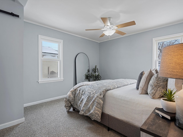 bedroom with crown molding, ceiling fan, carpet flooring, and baseboards