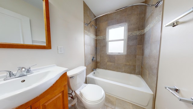 full bathroom with vanity, tiled shower / bath, and toilet