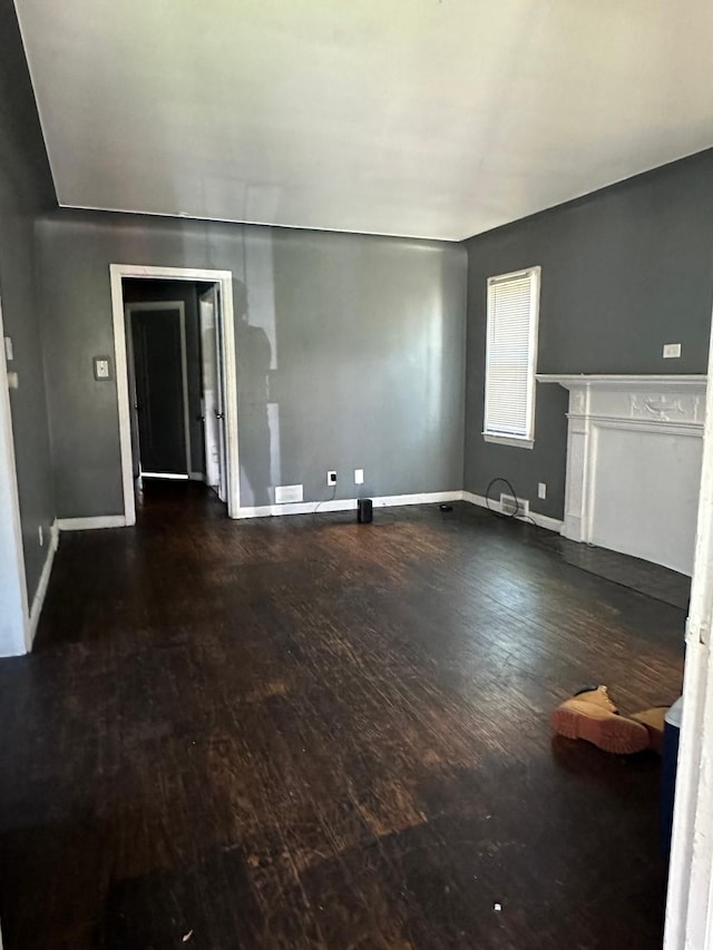 unfurnished room with hardwood / wood-style flooring