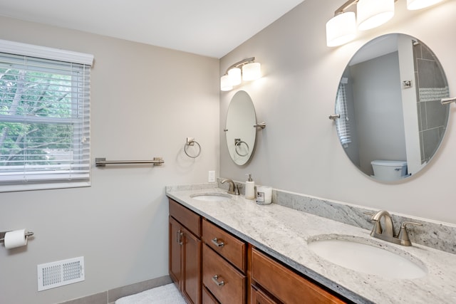 bathroom with vanity and toilet