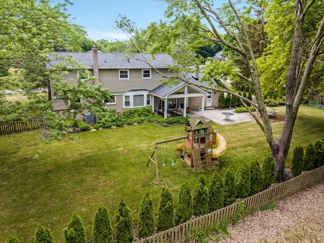 exterior space featuring a playground, a yard, and a patio area