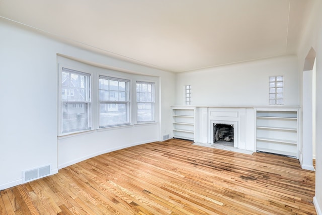 unfurnished living room with light hardwood / wood-style floors