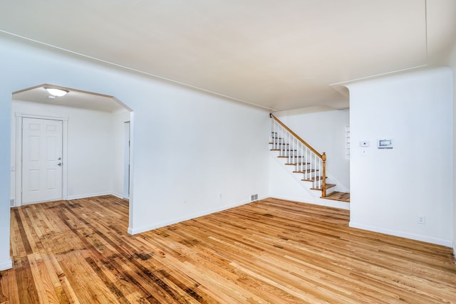 unfurnished room with light wood-type flooring