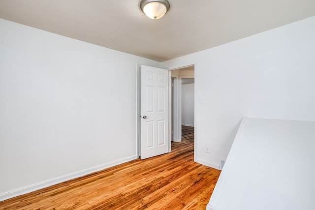 unfurnished room with light hardwood / wood-style flooring