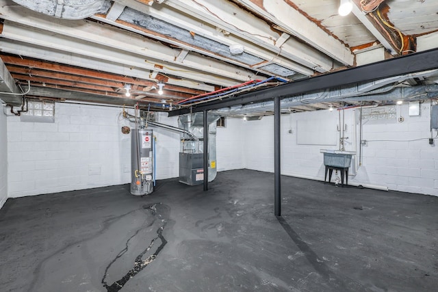 basement with gas water heater, sink, and heating unit