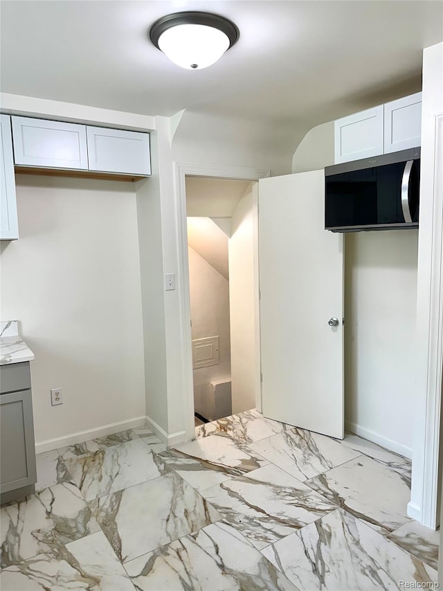 18500 Lindsay St, Detroit, MI 48235 - unfurnished bedroom featuring baseboards and light marble finish floors