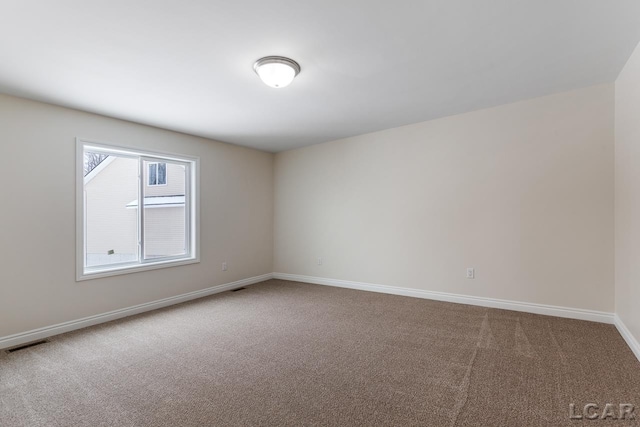 view of carpeted spare room