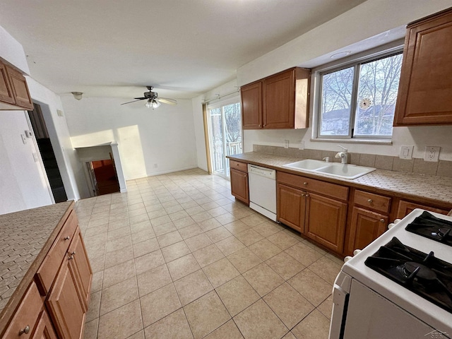 kitchen featuring ceiling fan, white appliances, light tile patterned flooring, and sink