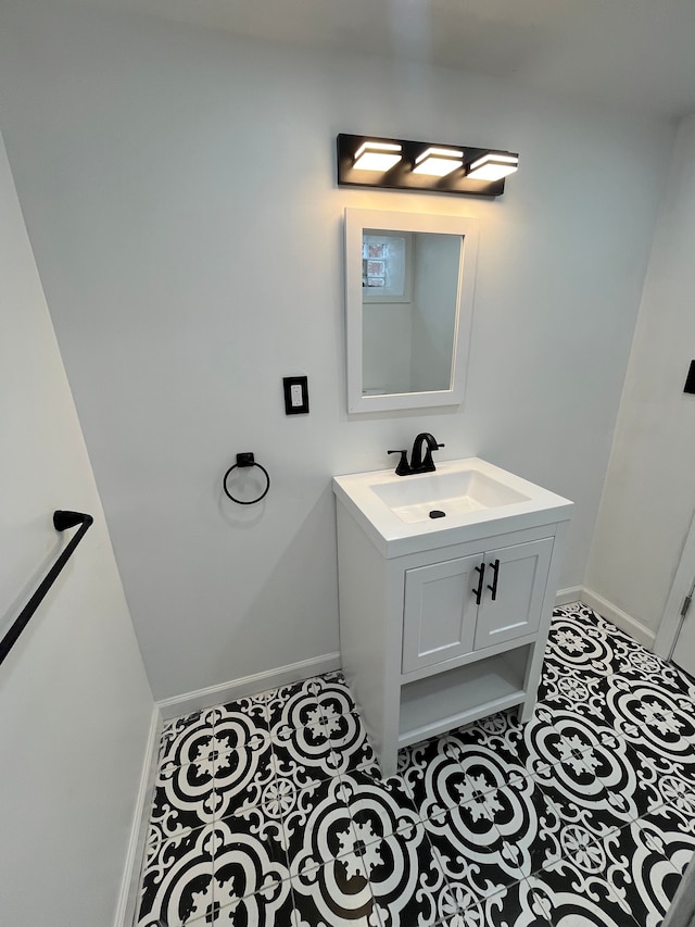 bathroom featuring tile patterned flooring and vanity