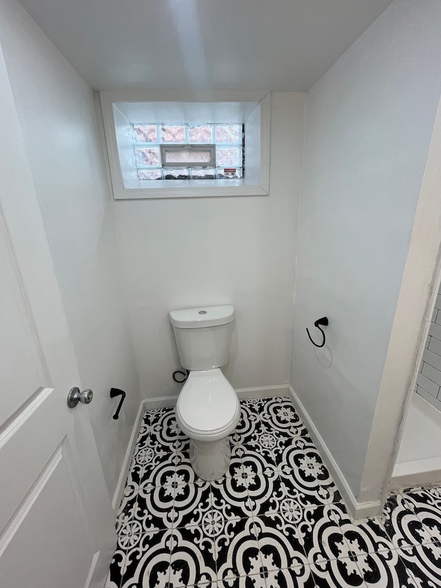 bathroom featuring tile patterned floors and toilet