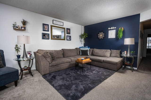 carpeted living room featuring a textured ceiling and baseboards