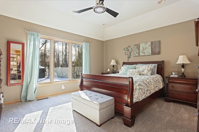 bedroom featuring ceiling fan and carpet