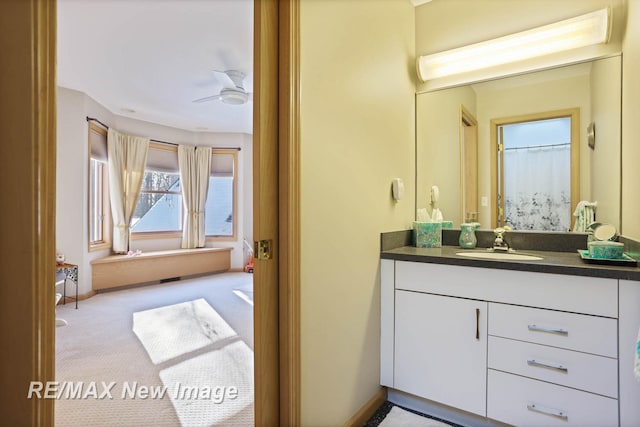 bathroom featuring vanity and ceiling fan