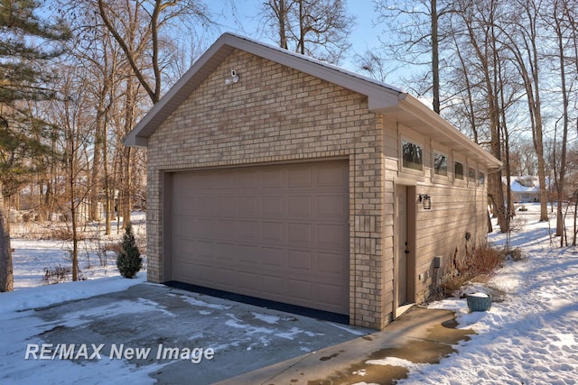 view of snow covered garage