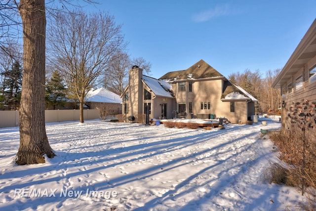 view of snow covered property