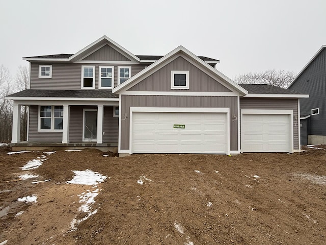 view of front of property featuring a garage and a porch