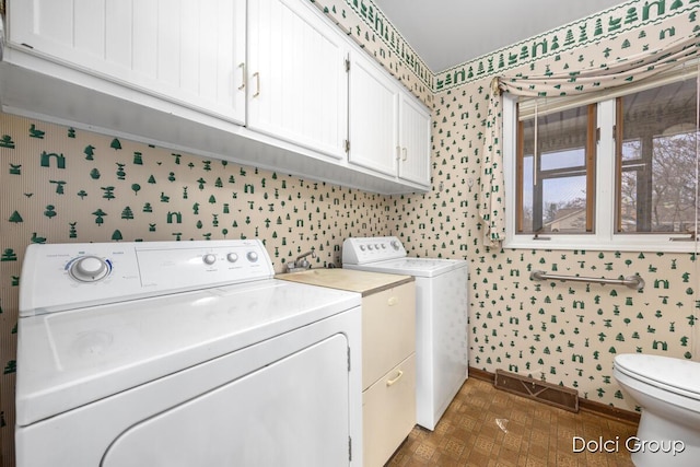 laundry room featuring washing machine and dryer