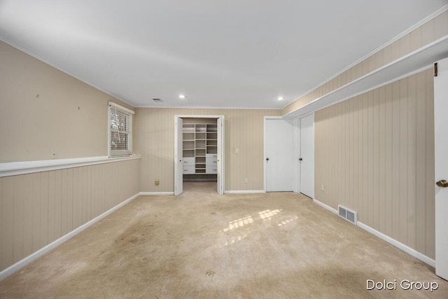 carpeted spare room with crown molding