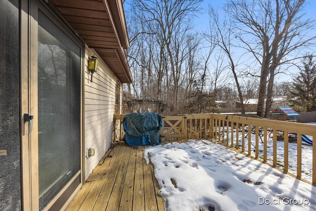 view of snow covered deck