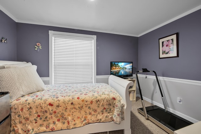 bedroom with crown molding and carpet floors