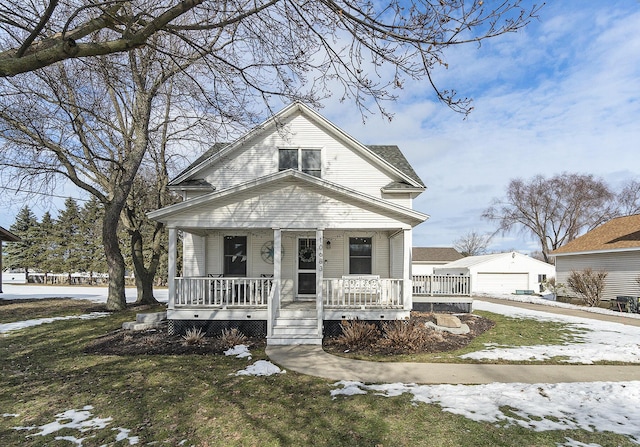 view of front of house with covered porch and a lawn