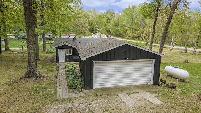 garage featuring a lawn