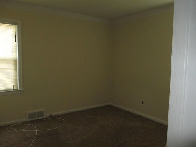 empty room with dark carpet