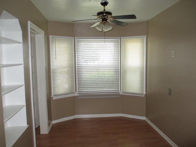 spare room featuring hardwood / wood-style flooring and ceiling fan