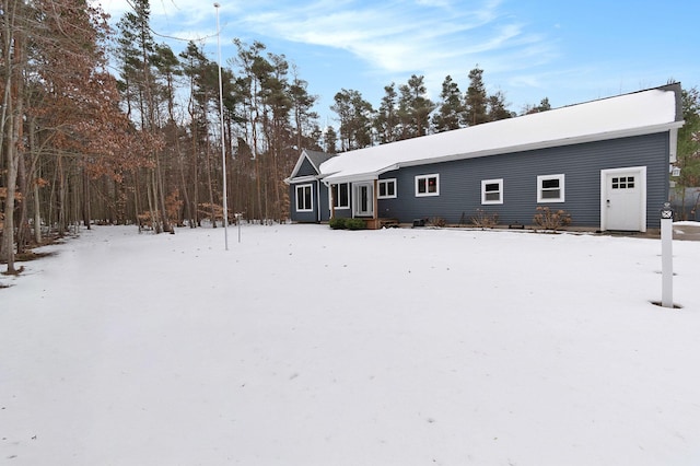 view of snow covered house