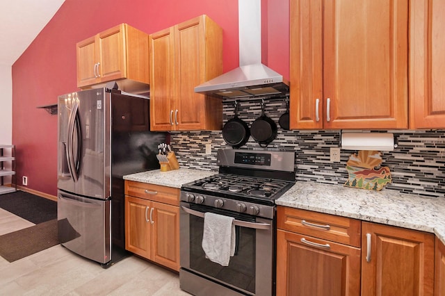 kitchen with light stone counters, appliances with stainless steel finishes, ventilation hood, and backsplash