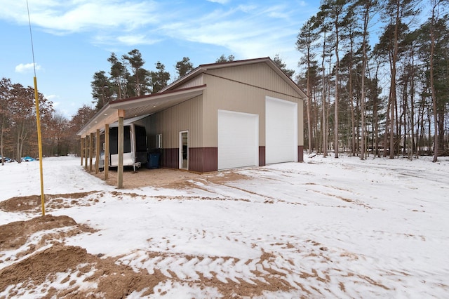 view of snow covered garage