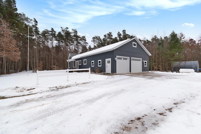 view of snow covered garage