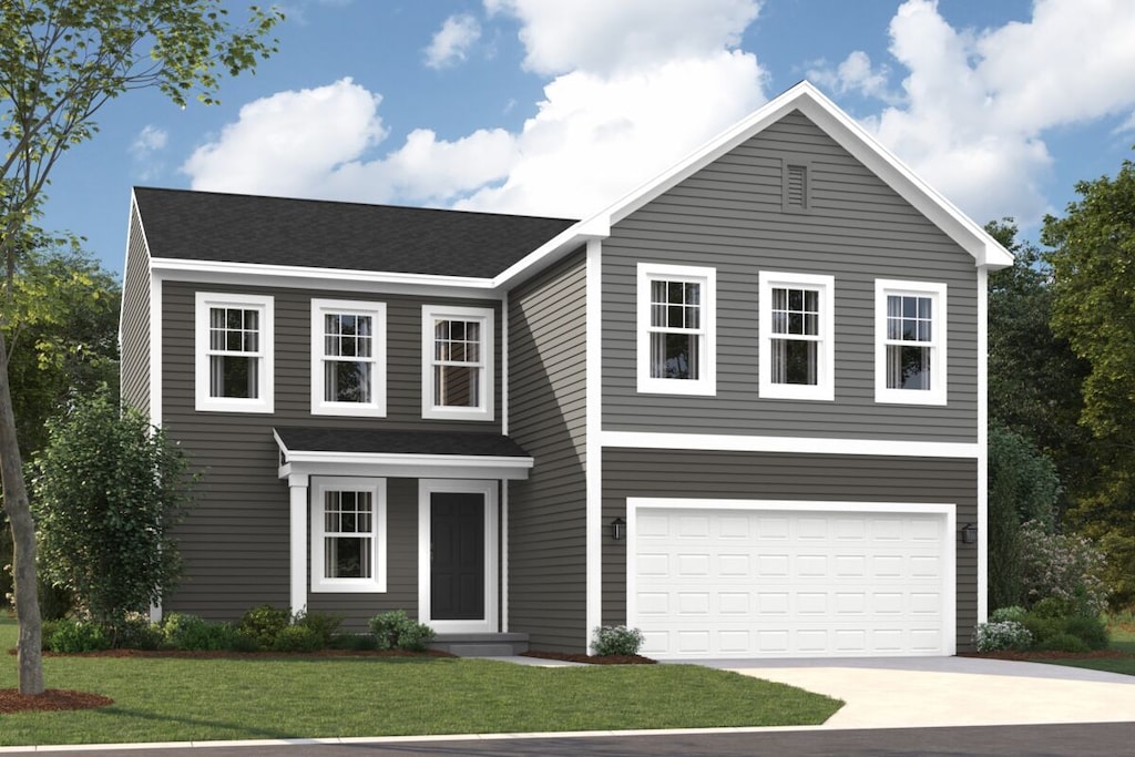 view of front of house featuring a garage and a front yard