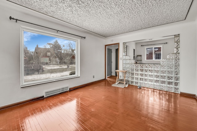 interior space featuring hardwood / wood-style floors and a textured ceiling