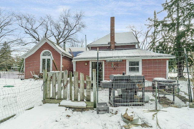 view of snow covered house