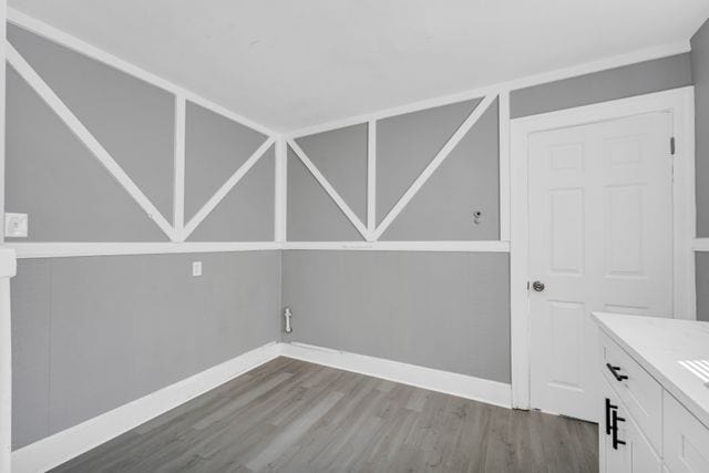 unfurnished room featuring hardwood / wood-style floors