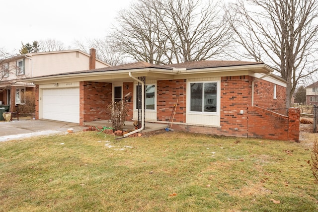 view of front of house featuring a garage and a front lawn