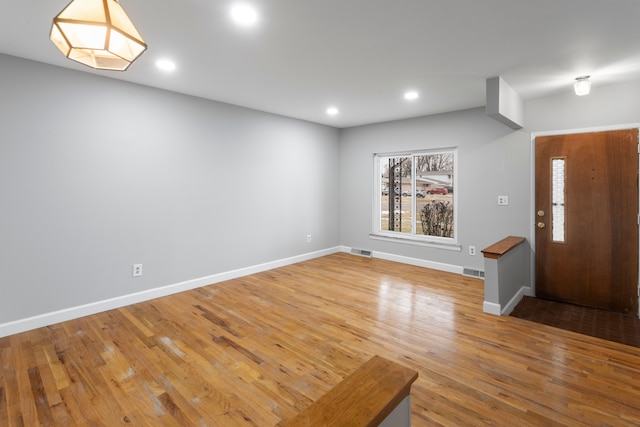 foyer entrance with hardwood / wood-style floors