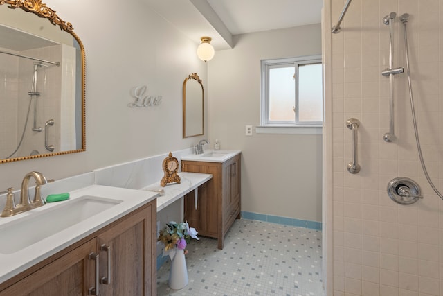 bathroom featuring vanity and a tile shower