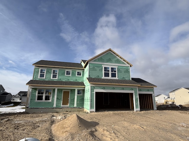 view of front of home featuring a garage and stucco siding