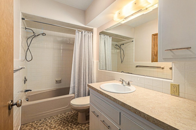 full bathroom with toilet, shower / tub combo, tile walls, vanity, and backsplash