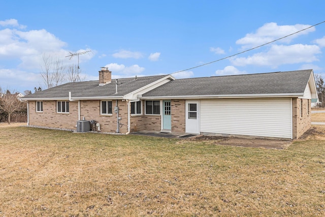 rear view of house featuring cooling unit and a lawn