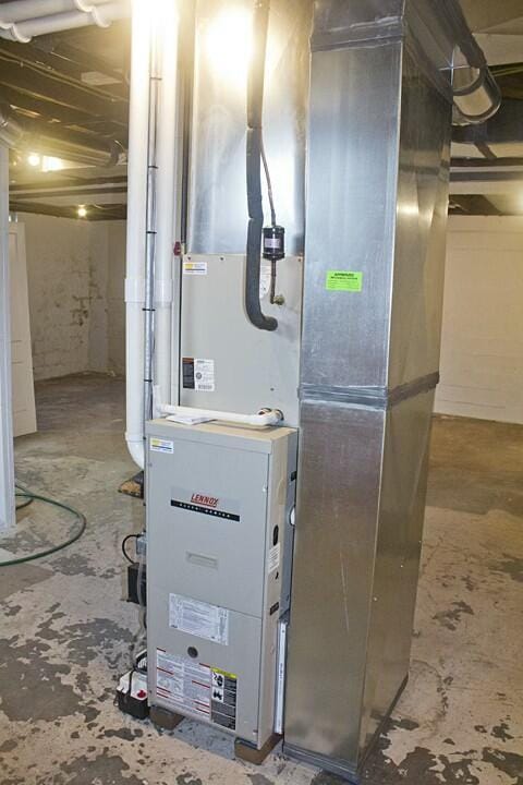 utility room with heating unit
