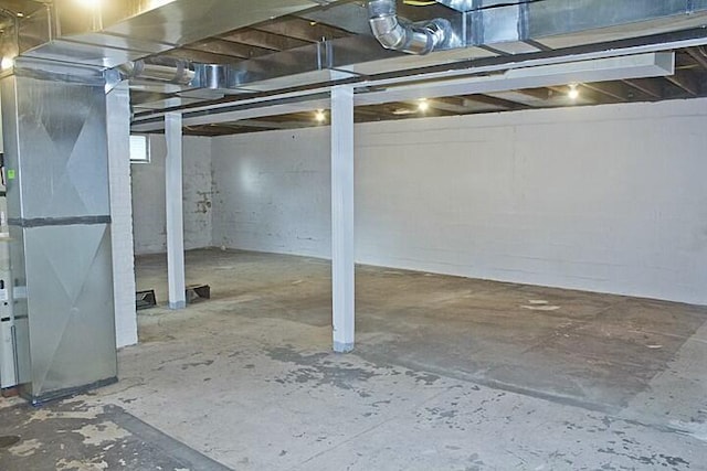 basement featuring heating unit