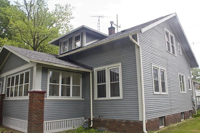 307 New York Ave, Dowagiac, MI 49047 - view of property exterior with a chimney