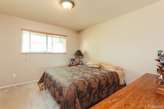 bedroom with light carpet