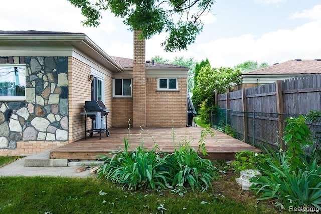 back of house featuring a deck