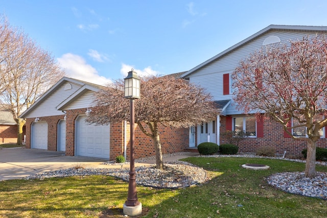 view of front of home featuring a garage and a front lawn