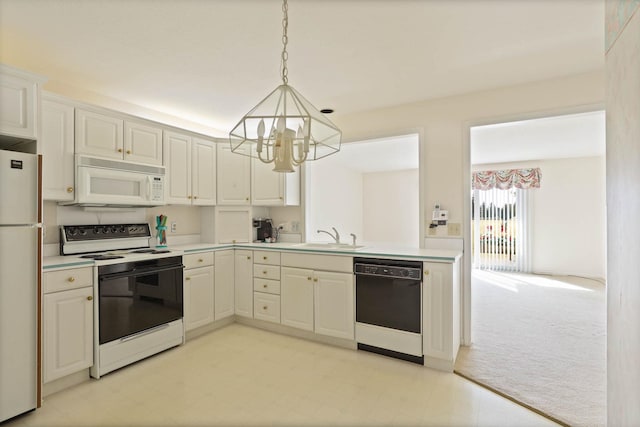 kitchen featuring a sink, white appliances, light carpet, and light countertops